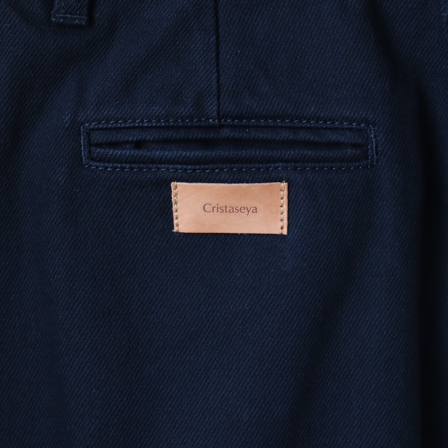 BLACK DENIM PLEATED TROUSERS