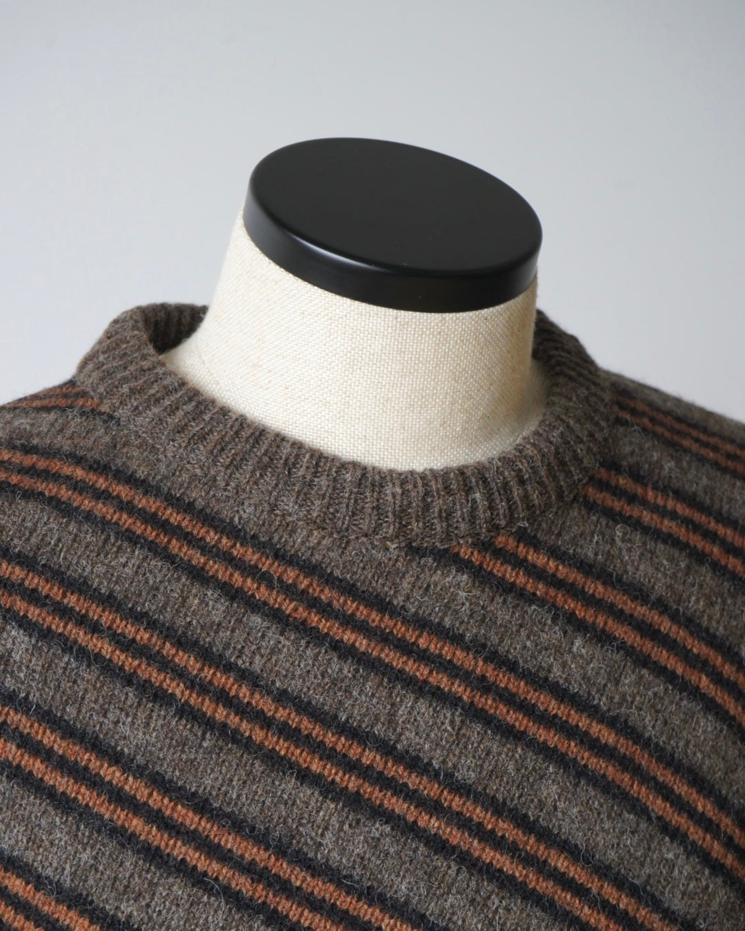 DIGONAL STRIPED SWEATER